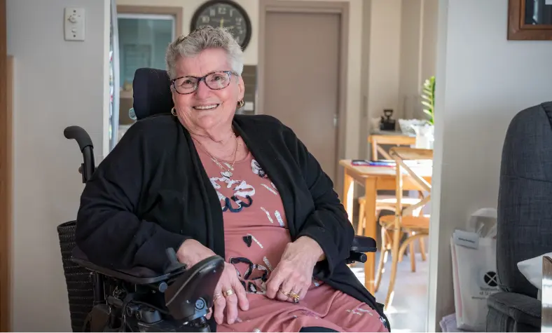 BSL aged care resident Shirley in a wheelchair