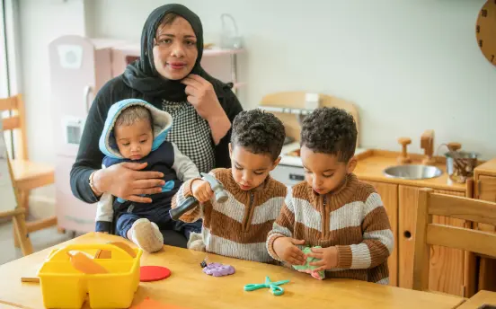Samar, with baby Quasem, and twins Ali (left) and Mohammed (right)