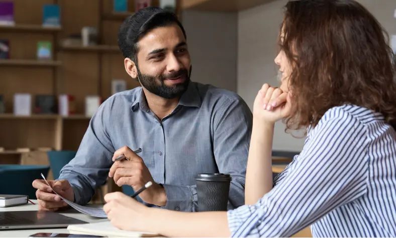 Two people in discussion together